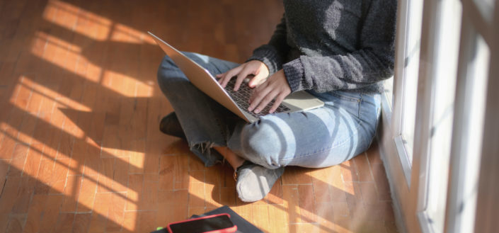 Bokksu review - How to Join Bokksu.jpegblue denim jeans using a laptop while sitting on wooden floor