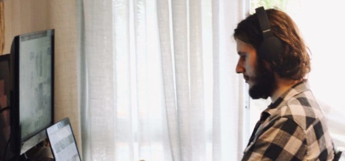 Man with headphones on working